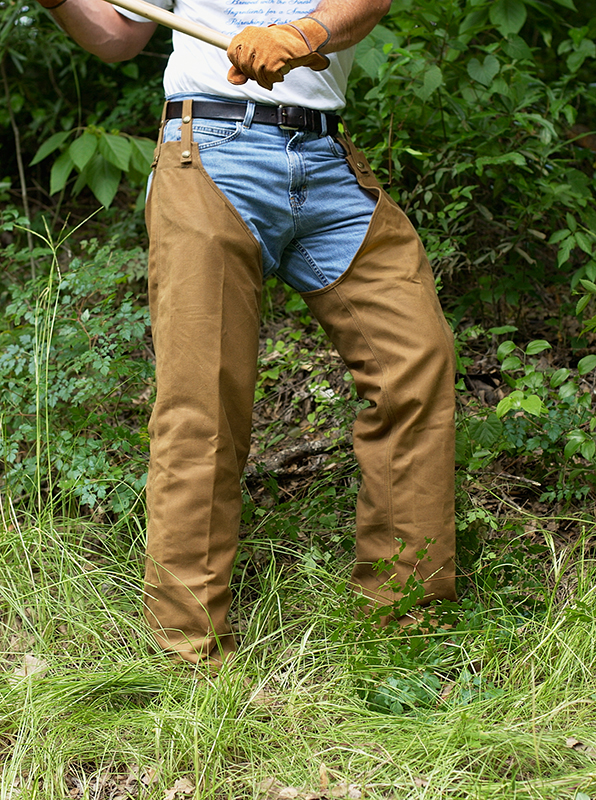 worker wearing Turtleskin® Total Protection Chaps  when cutting brush